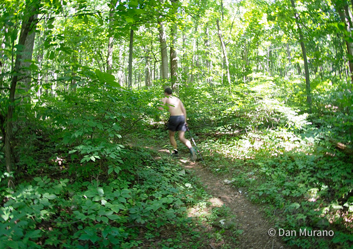 A hiker running on the trail.