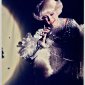 Kevin Bossolono as Carol Channing during a performance at the Home Circle Club. Scan from vintage print.